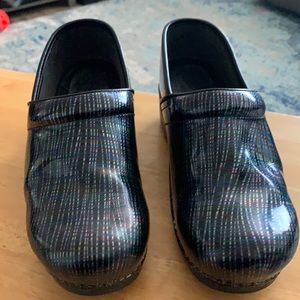 Dansko clogs, size 41. Black base color with multicolor striping.
